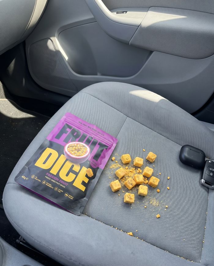 Passion fruit pouch on a car seat